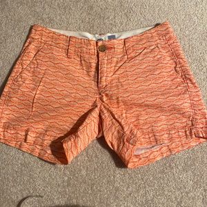 Cute shorts with coral color fish print .